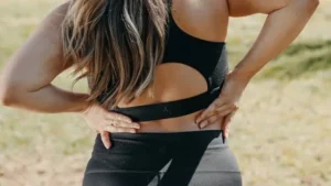 image of a woman stretching her back